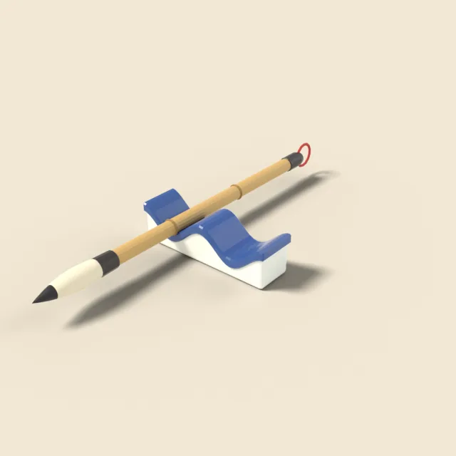Calligraphy brush on ceramic rest