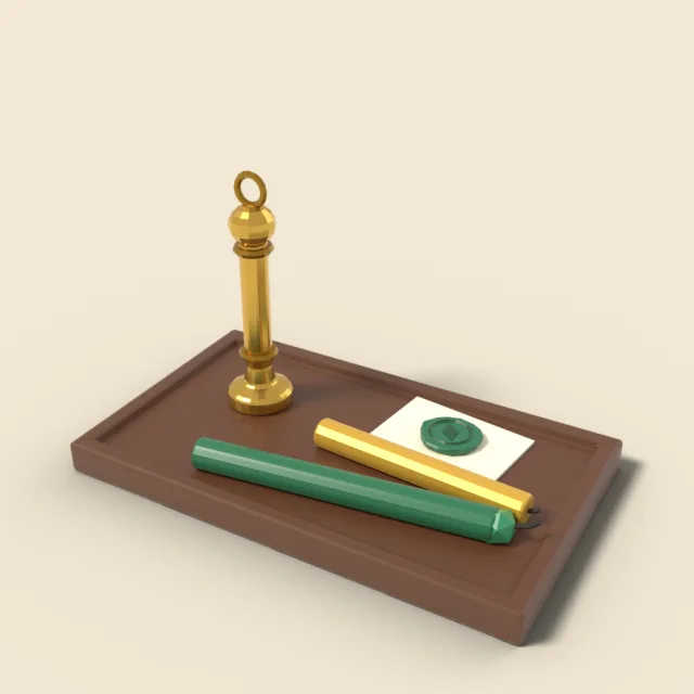 Brass wax seal stamp beside wax stick